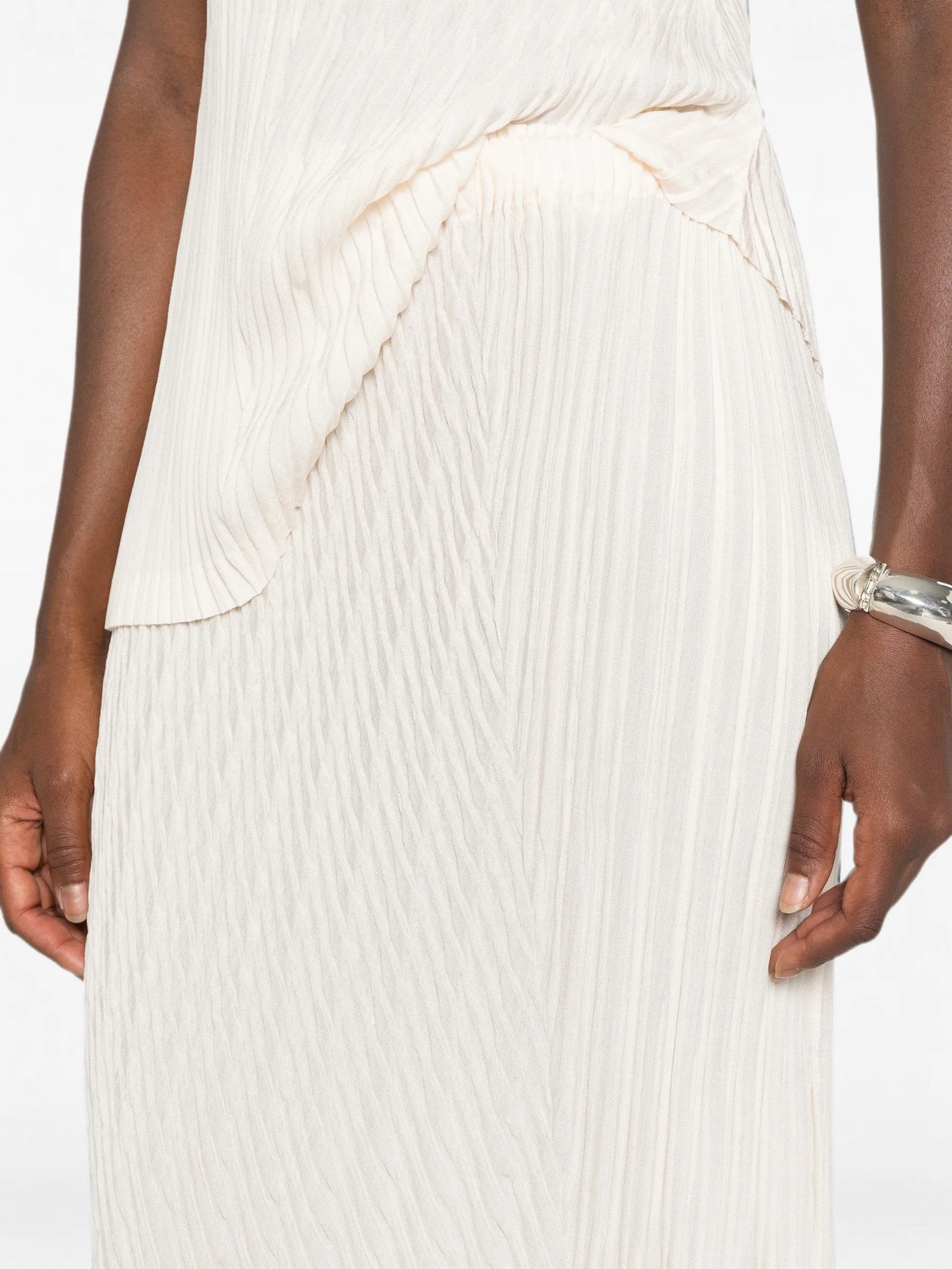 Unfurling pleats asymmetric midi skirt