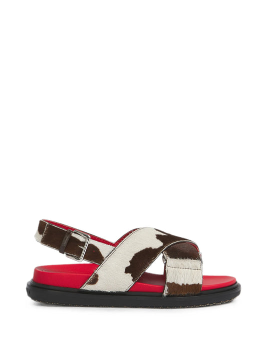 white and brown cow-print ponyhair Fussbett