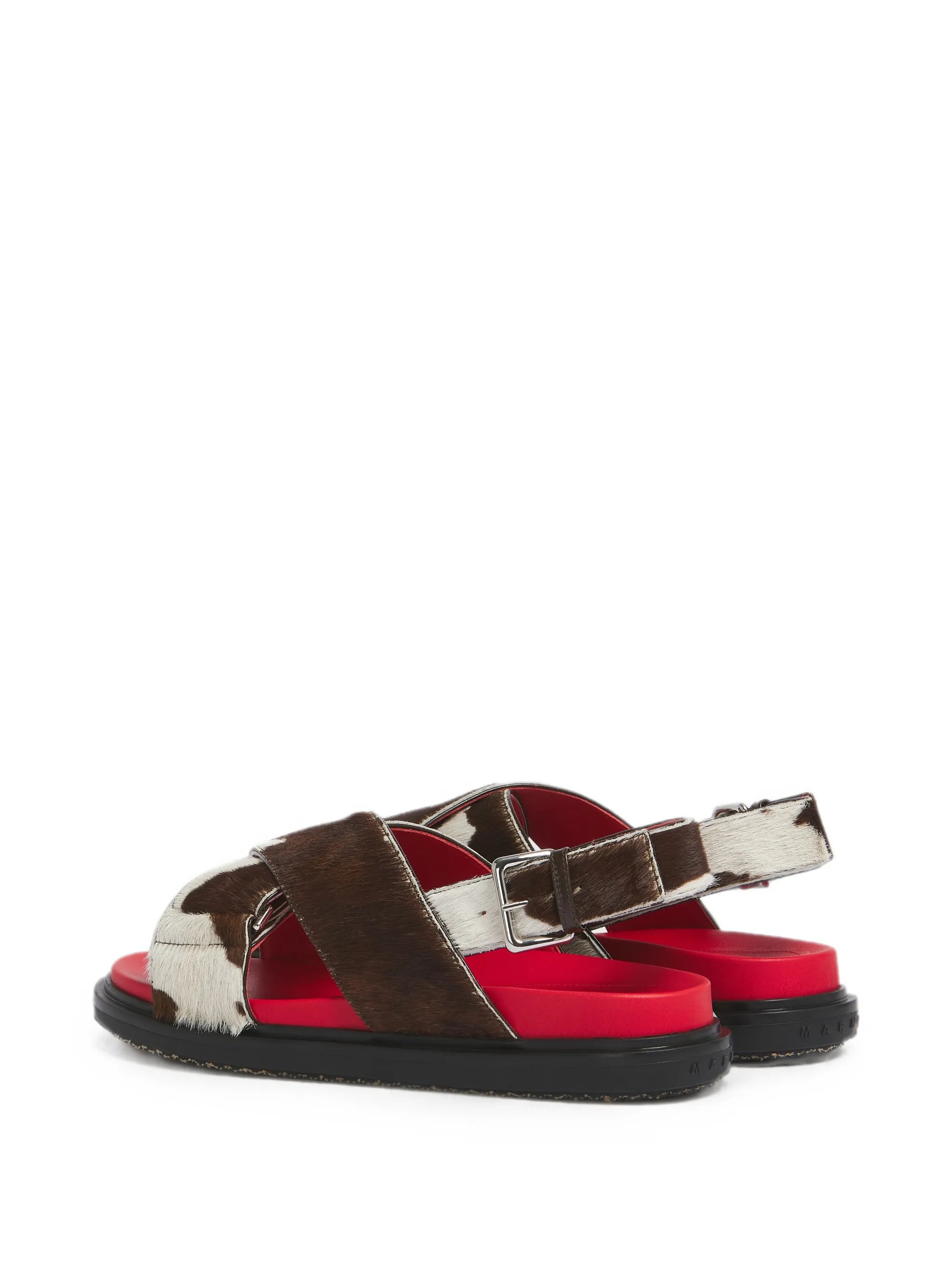 white and brown cow-print ponyhair Fussbett