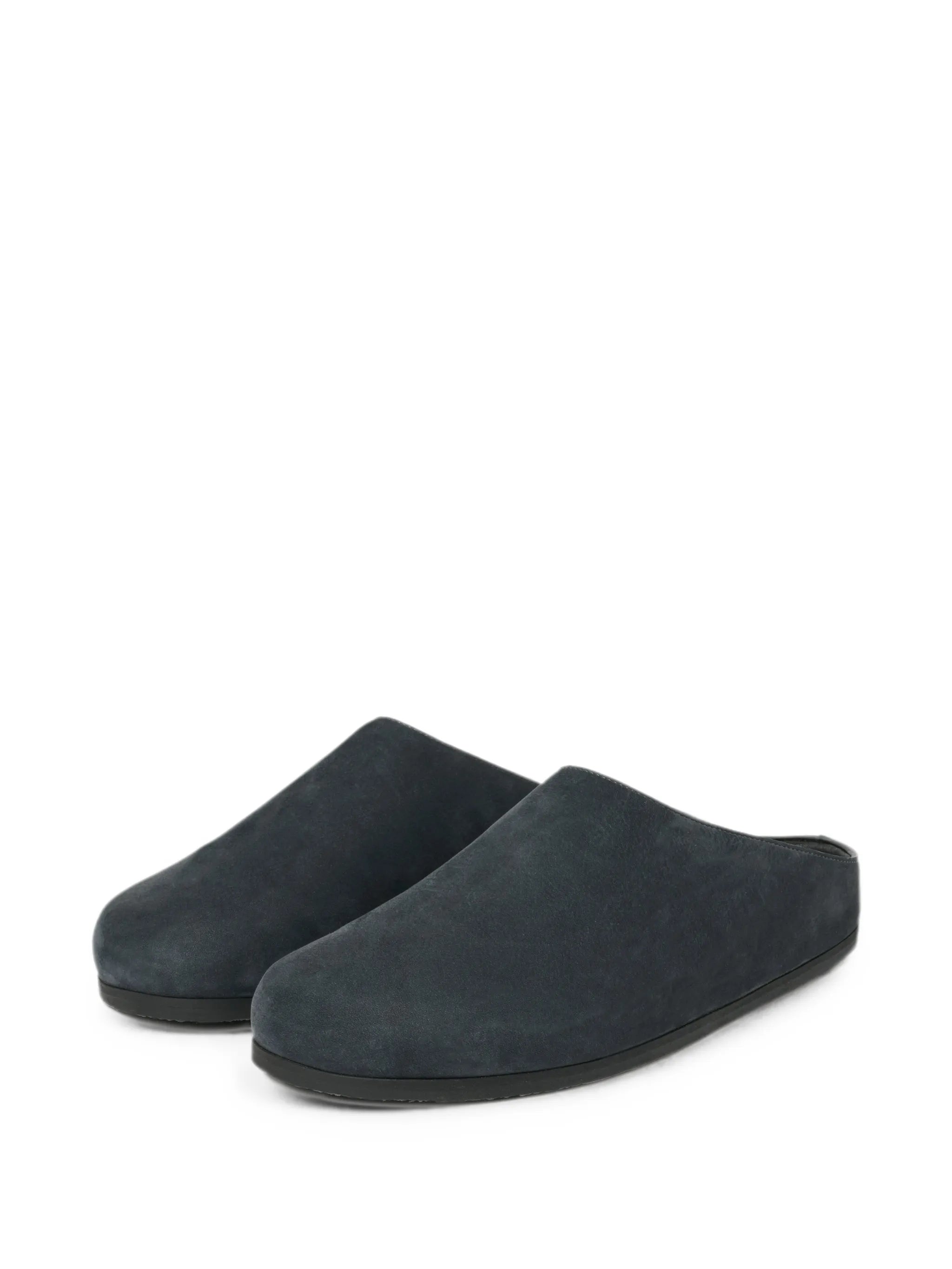 Wearing leather clogs