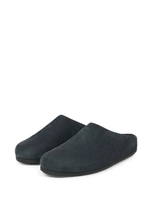 Wearing leather clogs