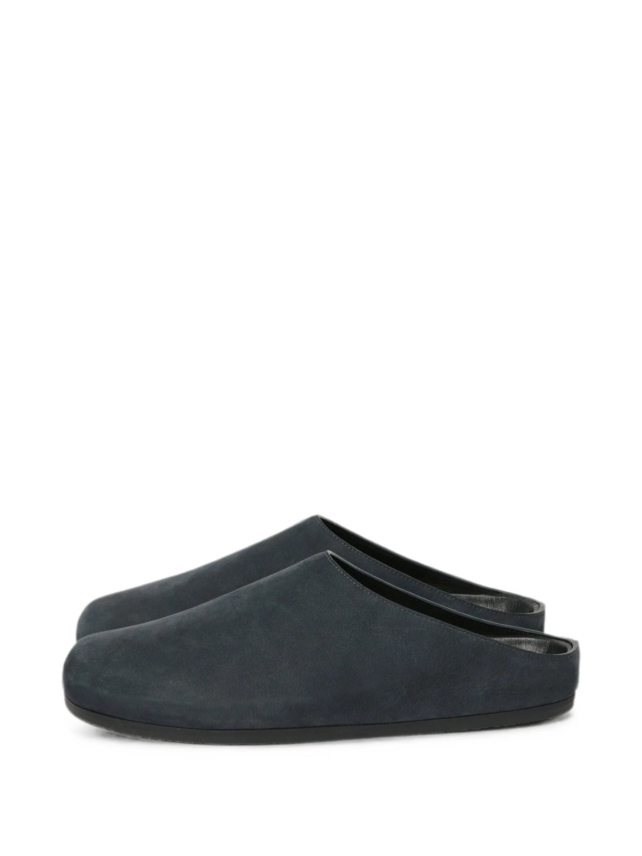 Wearing leather clogs