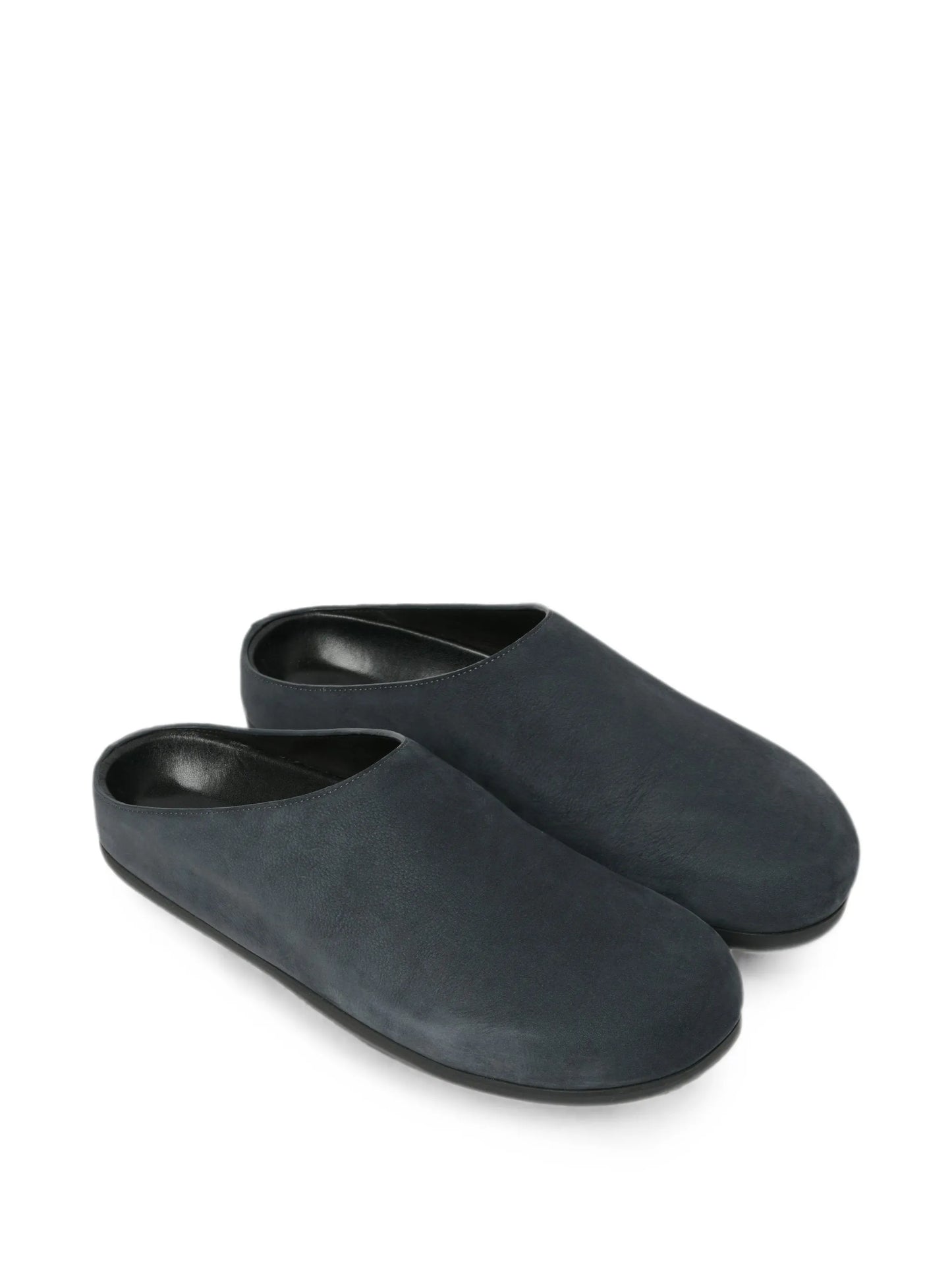 Wearing leather clogs