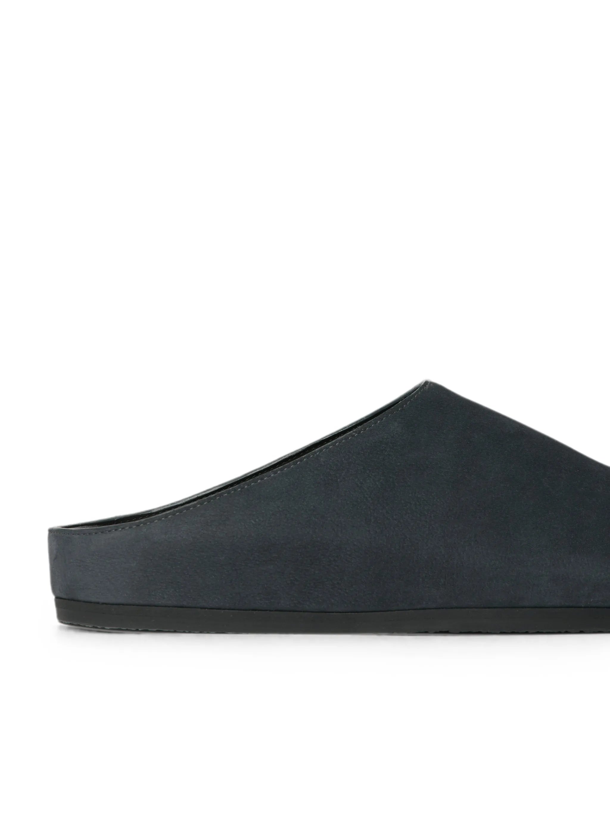 Wearing leather clogs