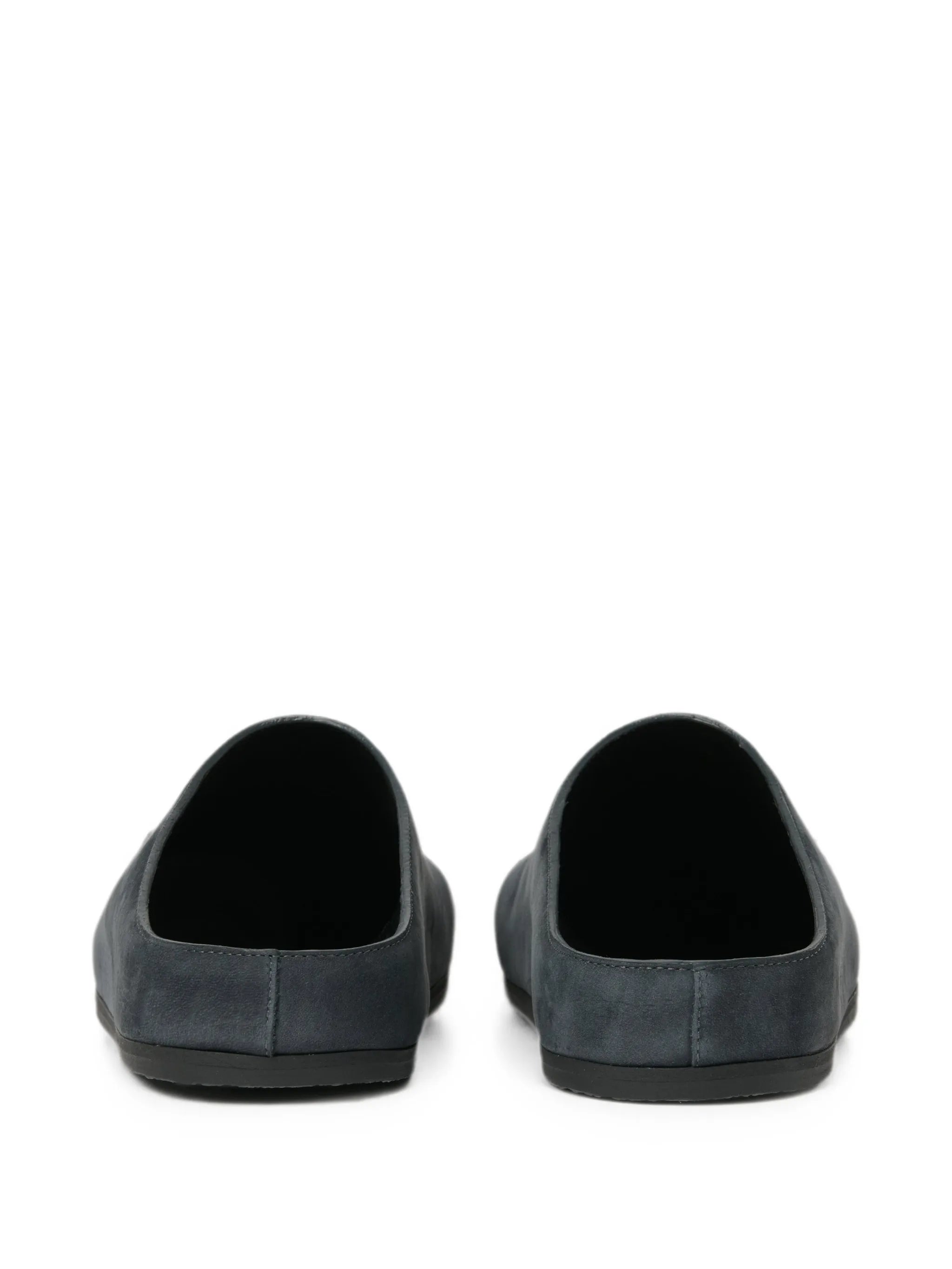 Wearing leather clogs