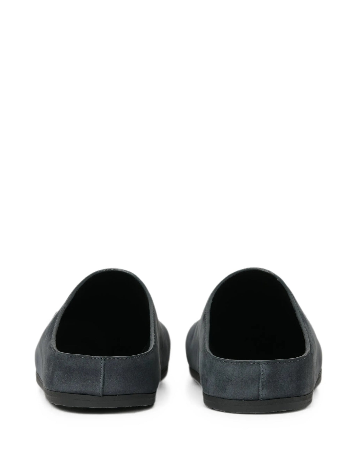 Wearing leather clogs