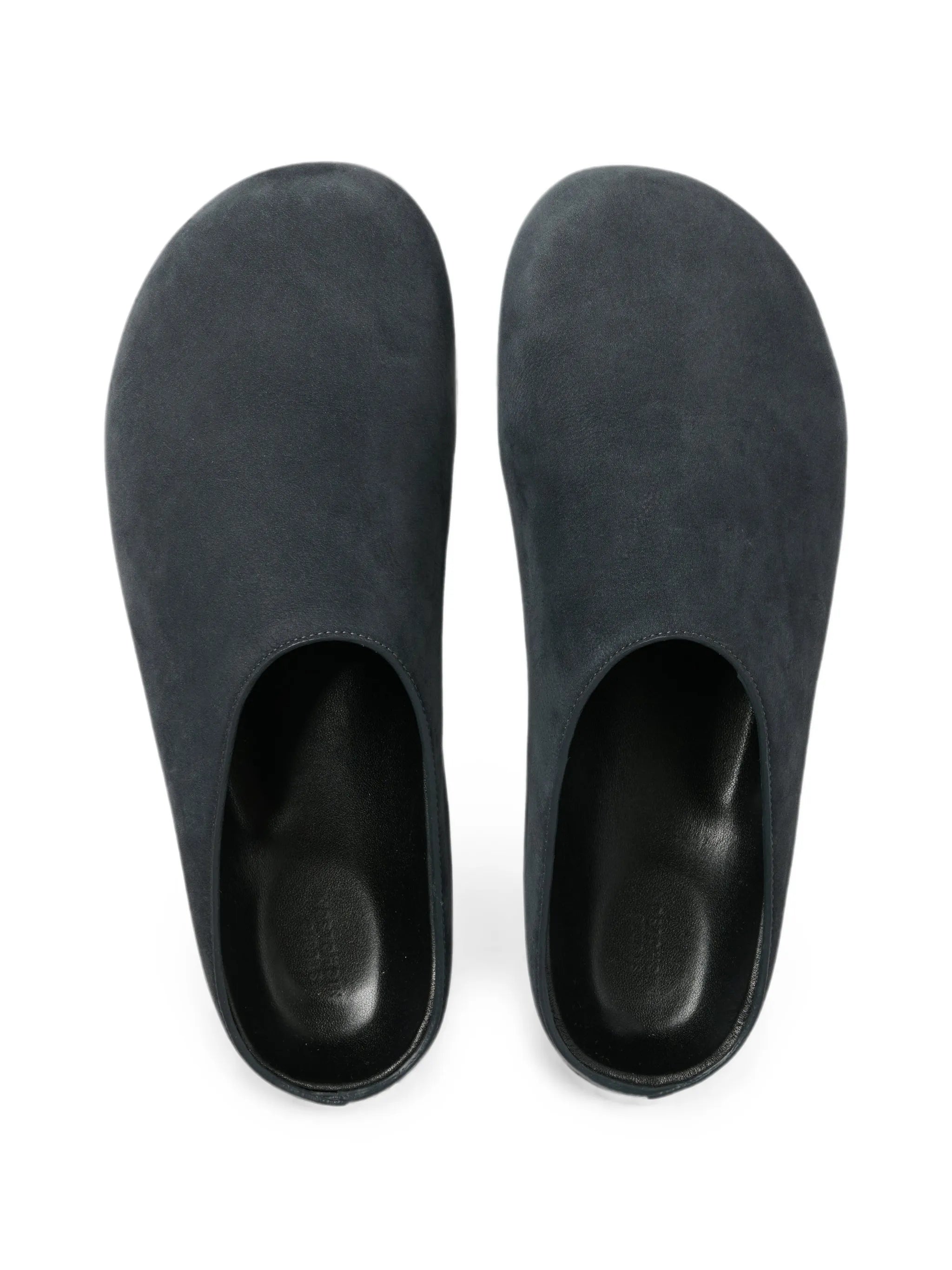 Wearing leather clogs