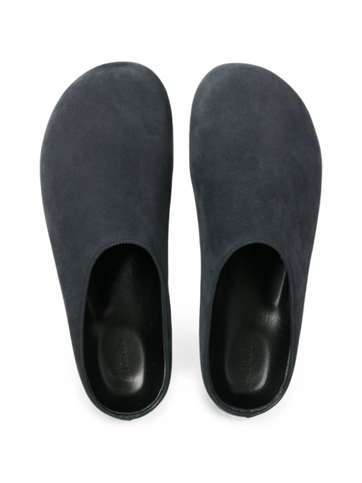 Wearing leather clogs