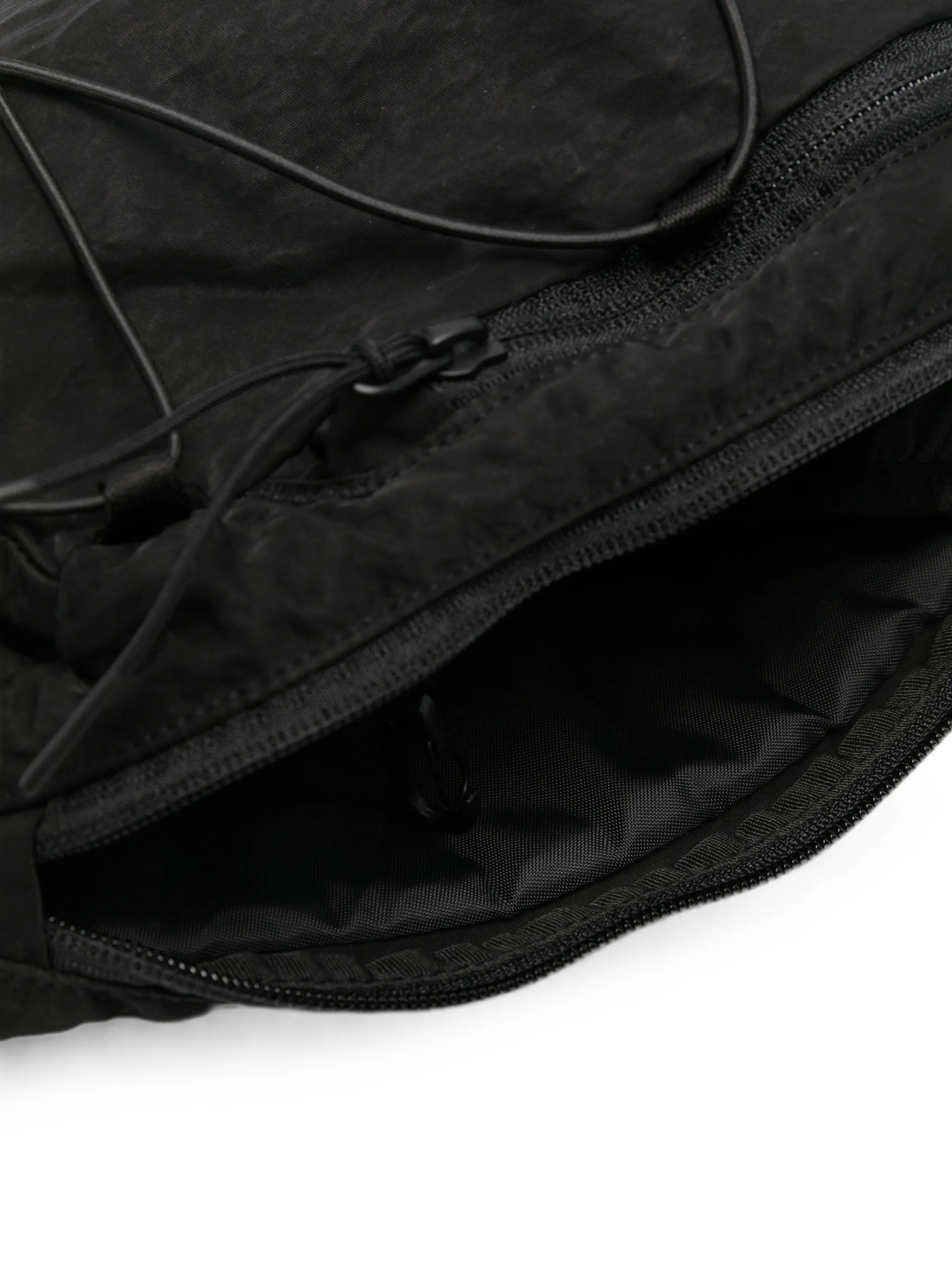 Lens-detail crossbody backpack