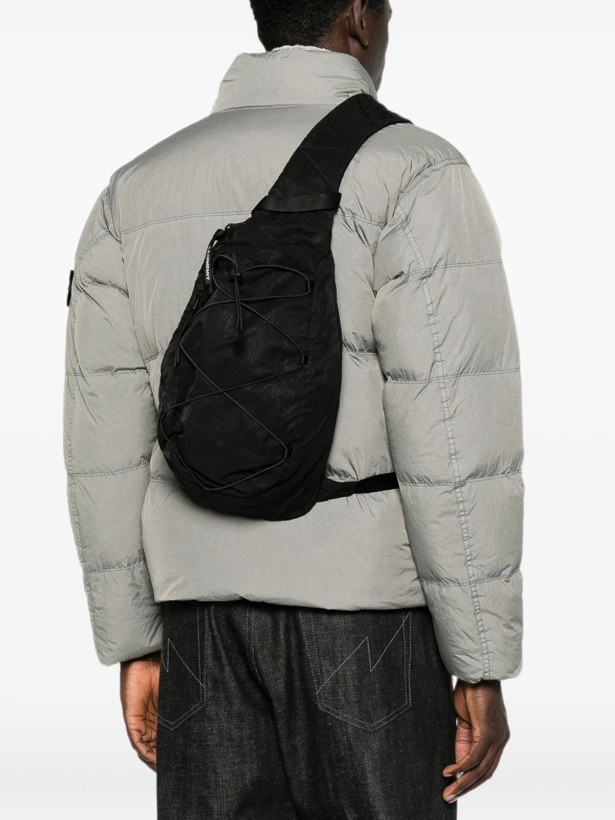 Lens-detail crossbody backpack