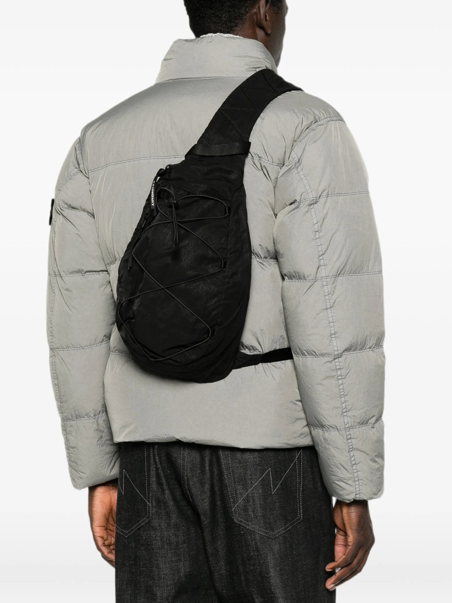 Lens-detail crossbody backpack